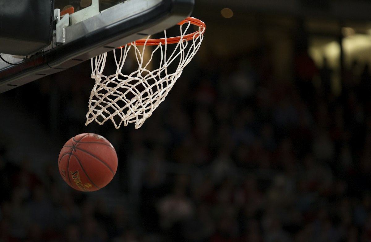 Basketball players competing
